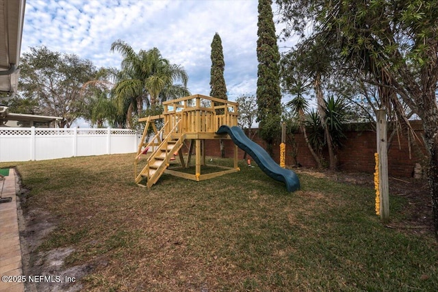 view of playground featuring a lawn