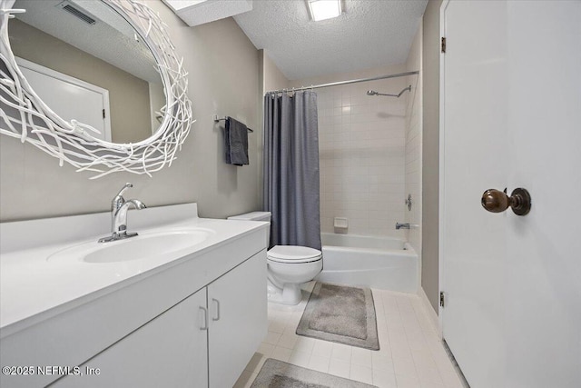 full bathroom featuring shower / tub combo with curtain, vanity, toilet, tile patterned floors, and a textured ceiling