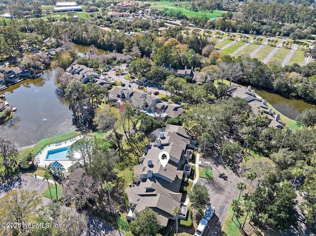 birds eye view of property with a water view