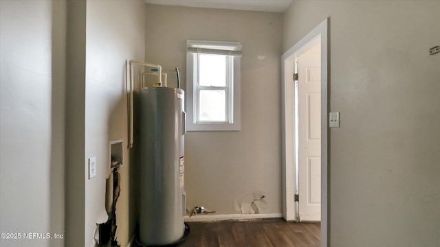 utility room with electric water heater