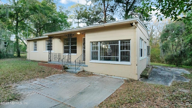 rear view of property featuring a patio