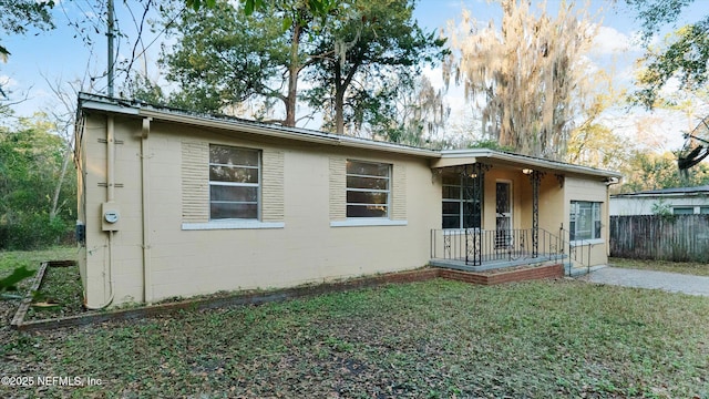 rear view of house with a yard