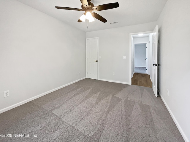 unfurnished bedroom with carpet and ceiling fan