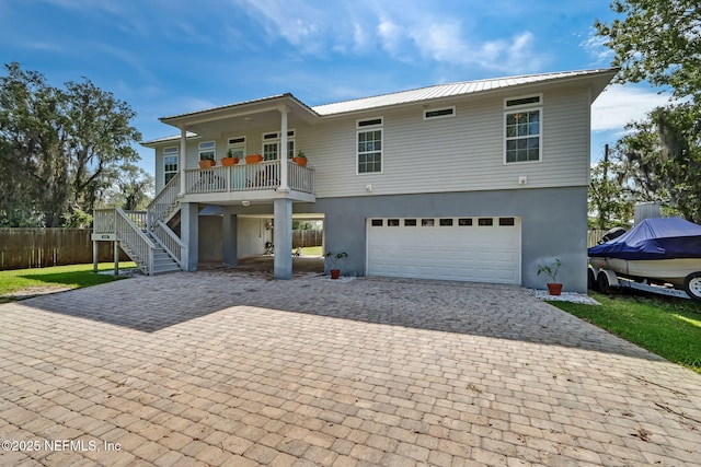 94202 Christopher Ln, Fernandina Beach, FL 32034 - front of property with a garage and covered porch