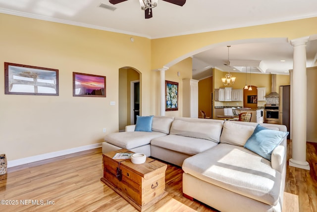 94202 Christopher Ln, Fernandina Beach, FL 32034 - living room with ornate columns, ornamental molding, and light hardwood / wood-style flooring