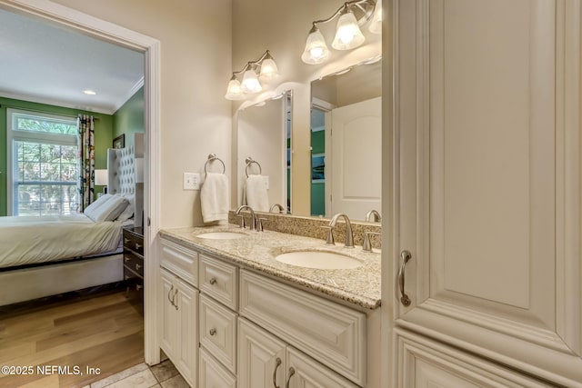 94202 Christopher Ln, Fernandina Beach, FL 32034 - bathroom featuring crown molding, wood-type flooring, and vanity