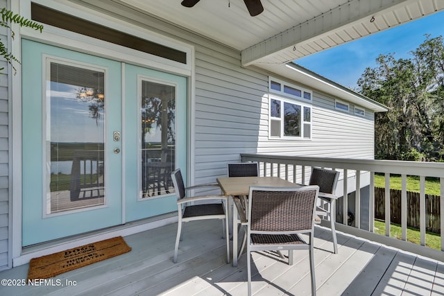 94202 Christopher Ln, Fernandina Beach, FL 32034 - wooden deck with french doors and ceiling fan