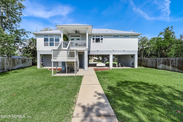 94202 Christopher Ln, Fernandina Beach, FL 32034 - back of house with a yard, a patio, and ceiling fan