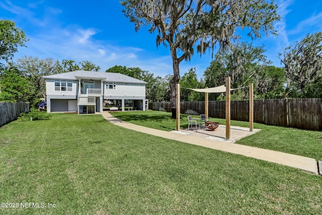 94202 Christopher Ln, Fernandina Beach, FL 32034 - view of yard featuring a fire pit and a balcony