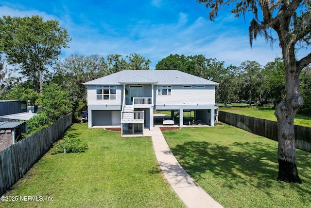 94202 Christopher Ln, Fernandina Beach, FL 32034 - view of front of property featuring a front lawn and a patio