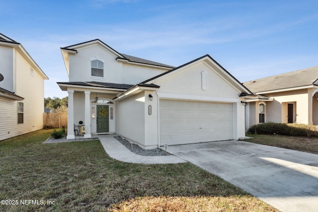 view of front of property with a garage and a front lawn