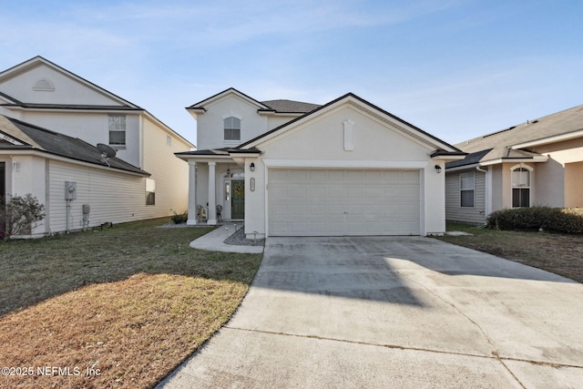 view of front of property featuring a garage and a front yard