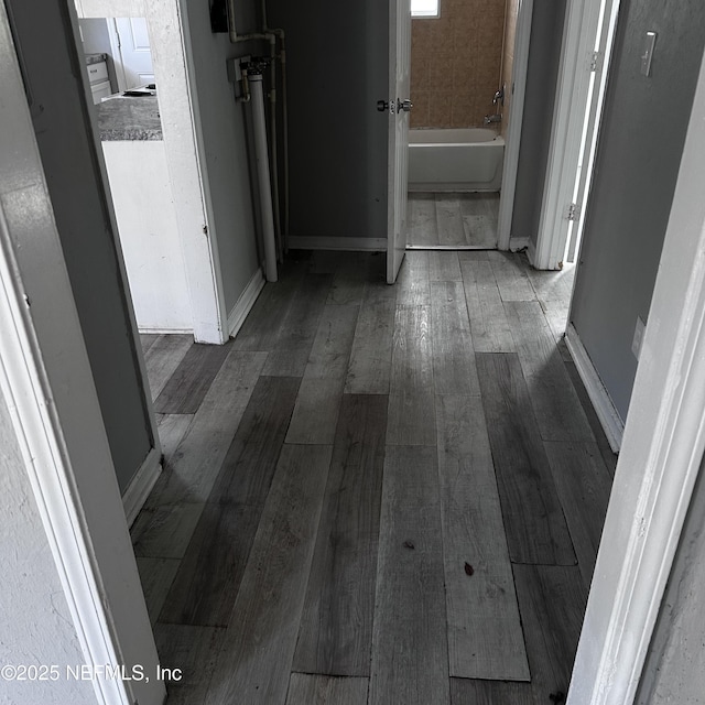 hallway featuring hardwood / wood-style flooring