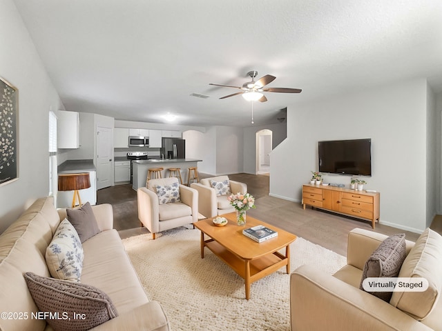 living room with ceiling fan