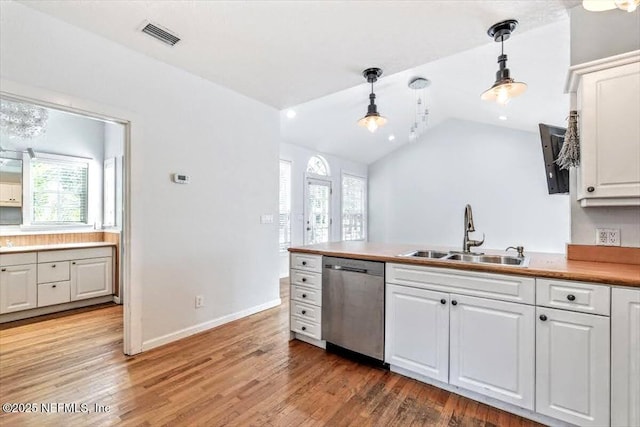 kitchen with white cabinets, dishwasher, light wood finished floors, and a sink