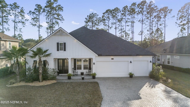 view of front of home featuring a garage and a front lawn