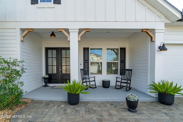 doorway to property with covered porch and french doors