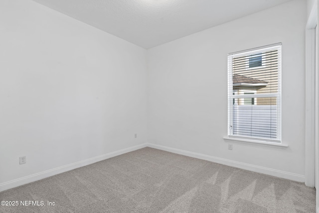 spare room with carpet flooring