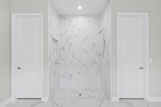 bathroom with a tile shower