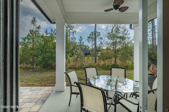 sunroom featuring ceiling fan