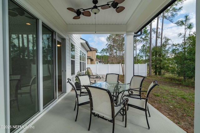 sunroom / solarium with ceiling fan