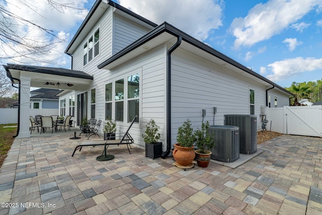 rear view of house featuring central AC, a patio, and ceiling fan