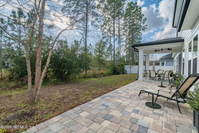 view of patio featuring ceiling fan