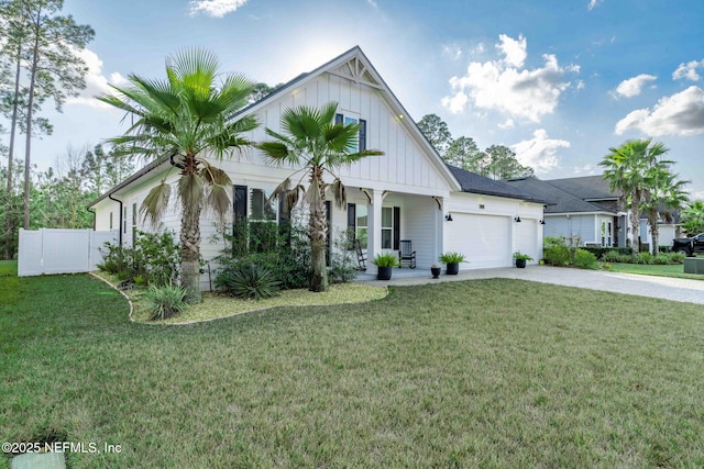 view of front of home featuring a garage and a front lawn