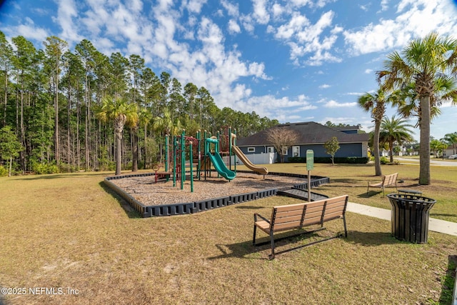 view of jungle gym featuring a lawn