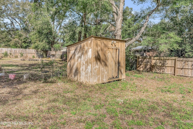 view of outdoor structure featuring a lawn