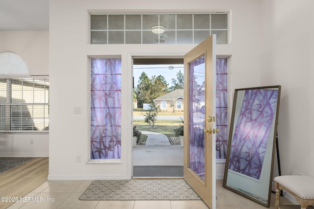 foyer featuring light tile patterned floors