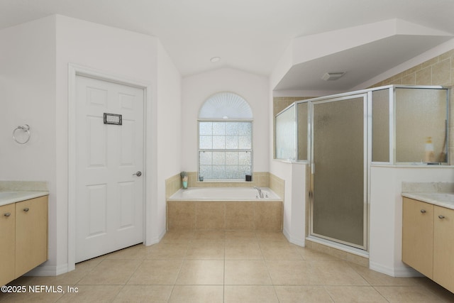 bathroom featuring tile patterned floors, plus walk in shower, and vaulted ceiling