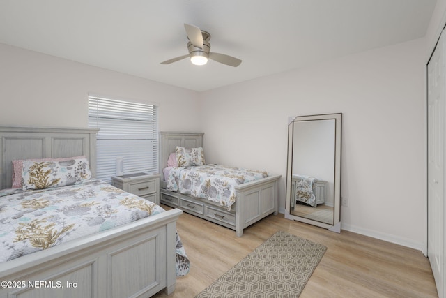 bedroom with ceiling fan and light hardwood / wood-style flooring