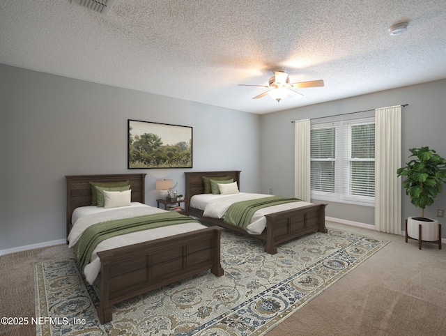 carpeted bedroom with a textured ceiling and ceiling fan