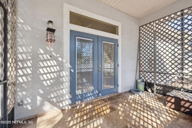 entrance to property featuring french doors