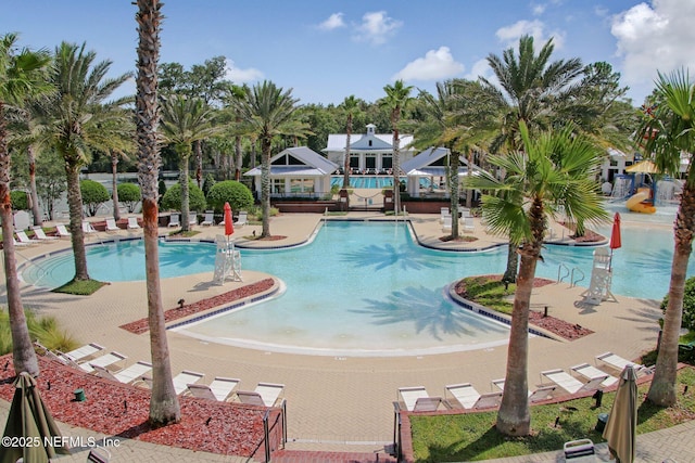 view of swimming pool with a patio