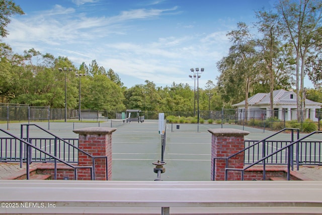 view of community with tennis court