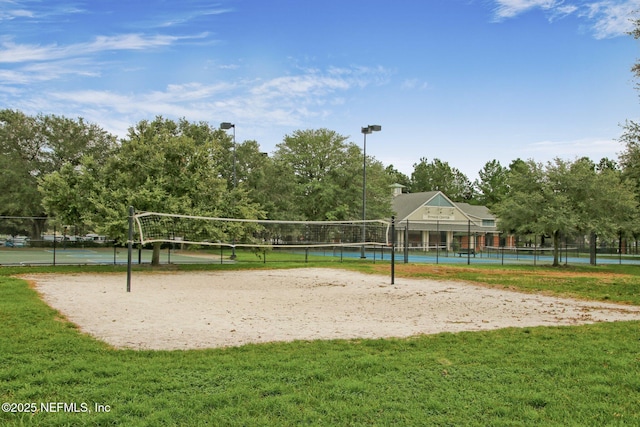 view of community featuring a lawn and volleyball court