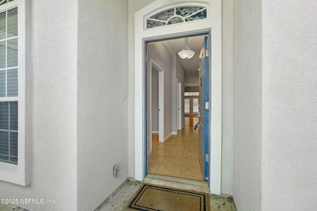 829 Songbird Dr, Orange Park, FL 32065 - doorway to property featuring stucco siding
