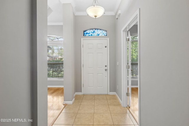 829 Songbird Dr, Orange Park, FL 32065 - foyer featuring crown molding, light tile patterned floors, and baseboards