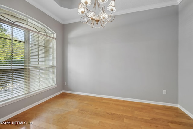 829 Songbird Dr, Orange Park, FL 32065 - empty room with a chandelier, crown molding, wood finished floors, and baseboards