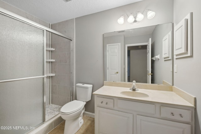 829 Songbird Dr, Orange Park, FL 32065 - bathroom with a shower stall, vanity, a textured ceiling, and toilet