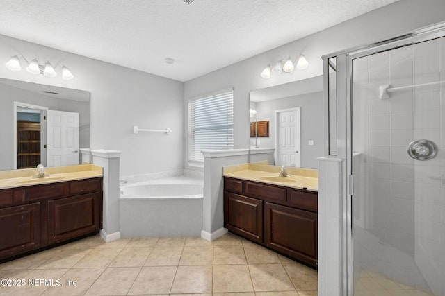 829 Songbird Dr, Orange Park, FL 32065 - full bath with a sink, tile patterned flooring, two vanities, and a stall shower