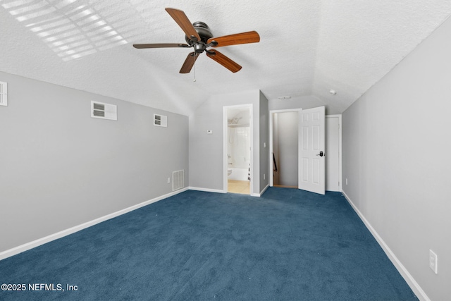 829 Songbird Dr, Orange Park, FL 32065 - unfurnished bedroom with visible vents, a textured ceiling, and lofted ceiling
