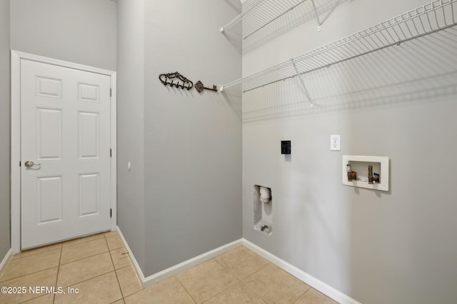 829 Songbird Dr, Orange Park, FL 32065 - laundry room featuring baseboards, washer hookup, laundry area, hookup for an electric dryer, and light tile patterned flooring