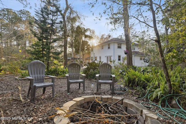 view of yard with a fire pit