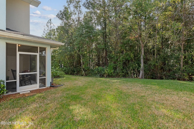 view of yard featuring a sunroom