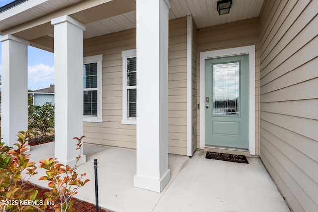 doorway to property featuring a porch