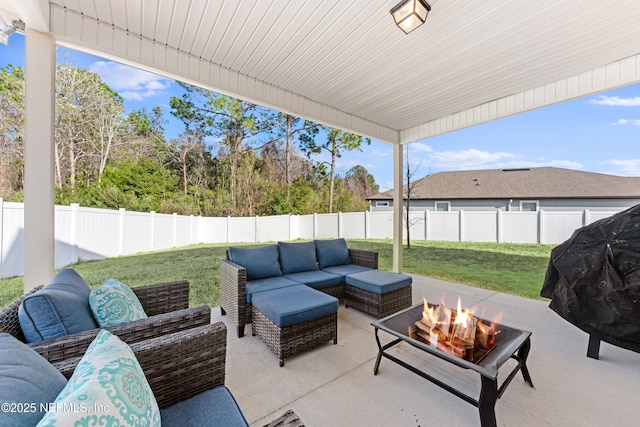 view of patio / terrace featuring an outdoor living space with a fire pit