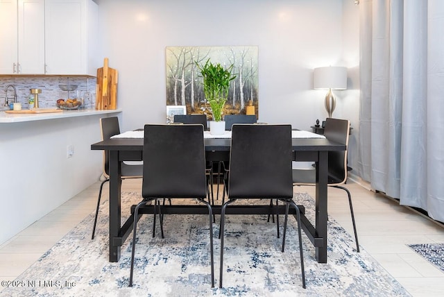 dining area with light wood-type flooring